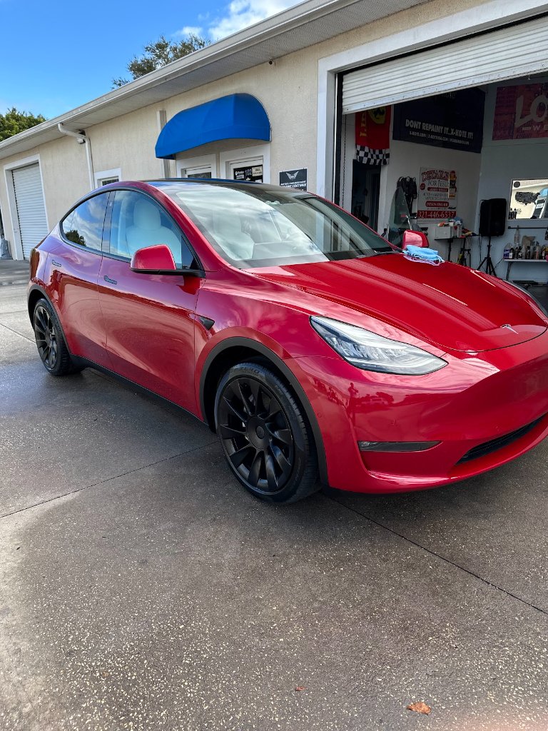 Red Tesla Model Y detailing
