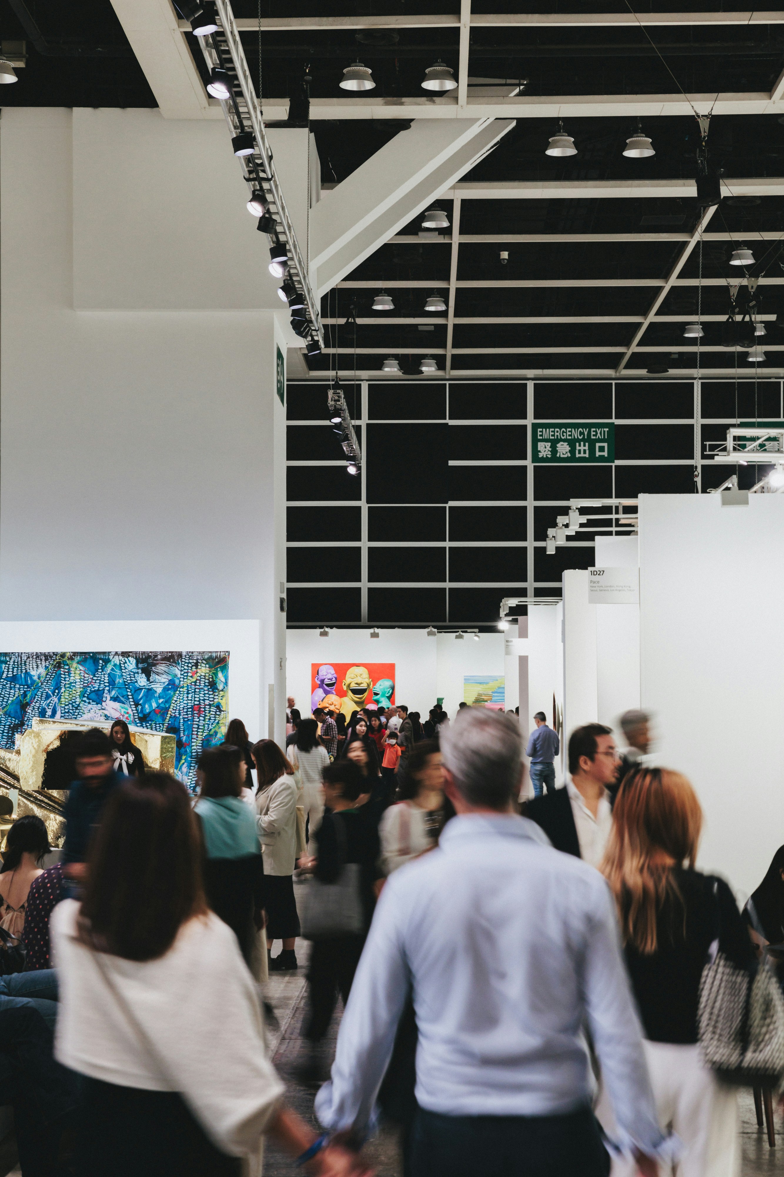 Crowd of buyers at a contemporary art fair.