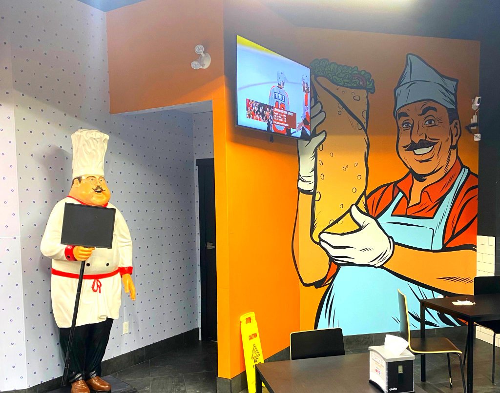 Deagla Restaurant exterior after completed mural and fresh paint