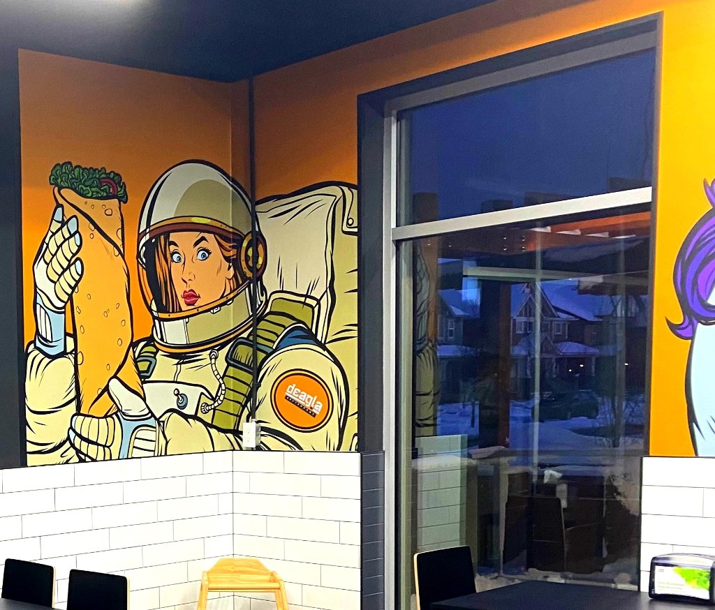 Deagla Restaurant showcasing vibrant mural graphics post-renovation