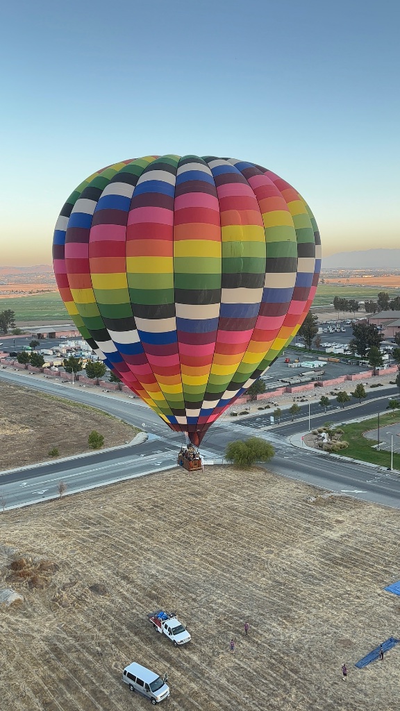 Hot air balloon launching at sunrise