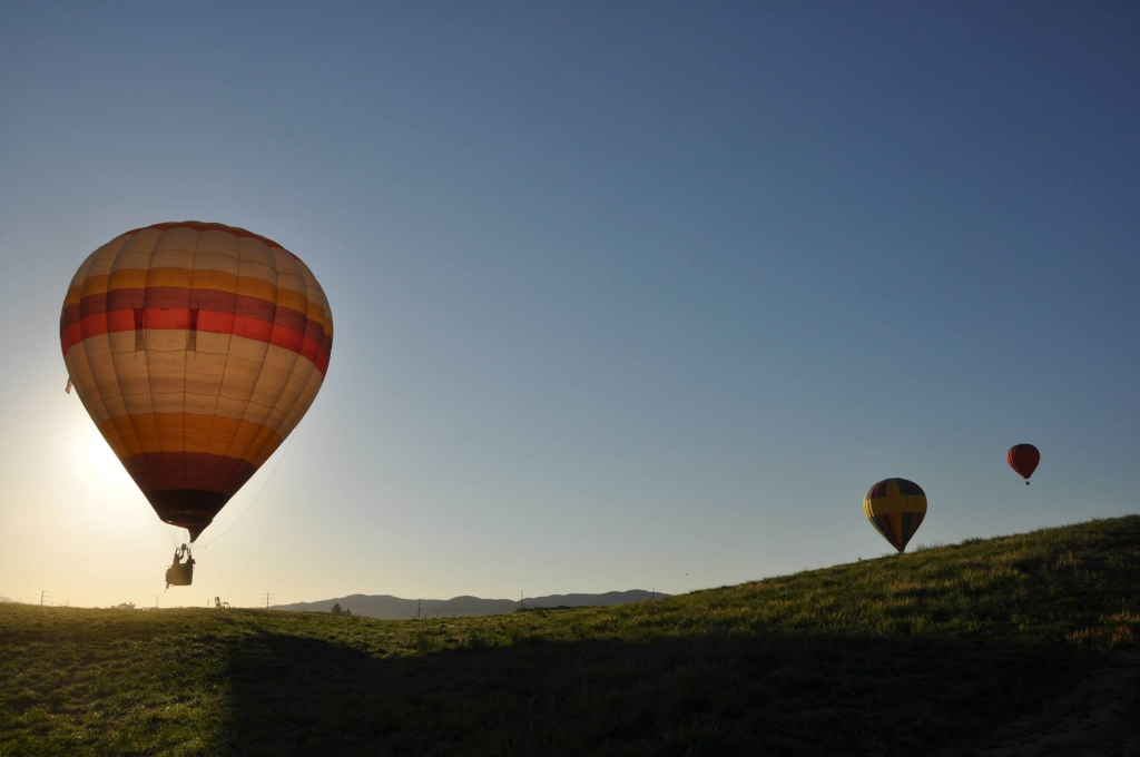 Three balloons at golden hour