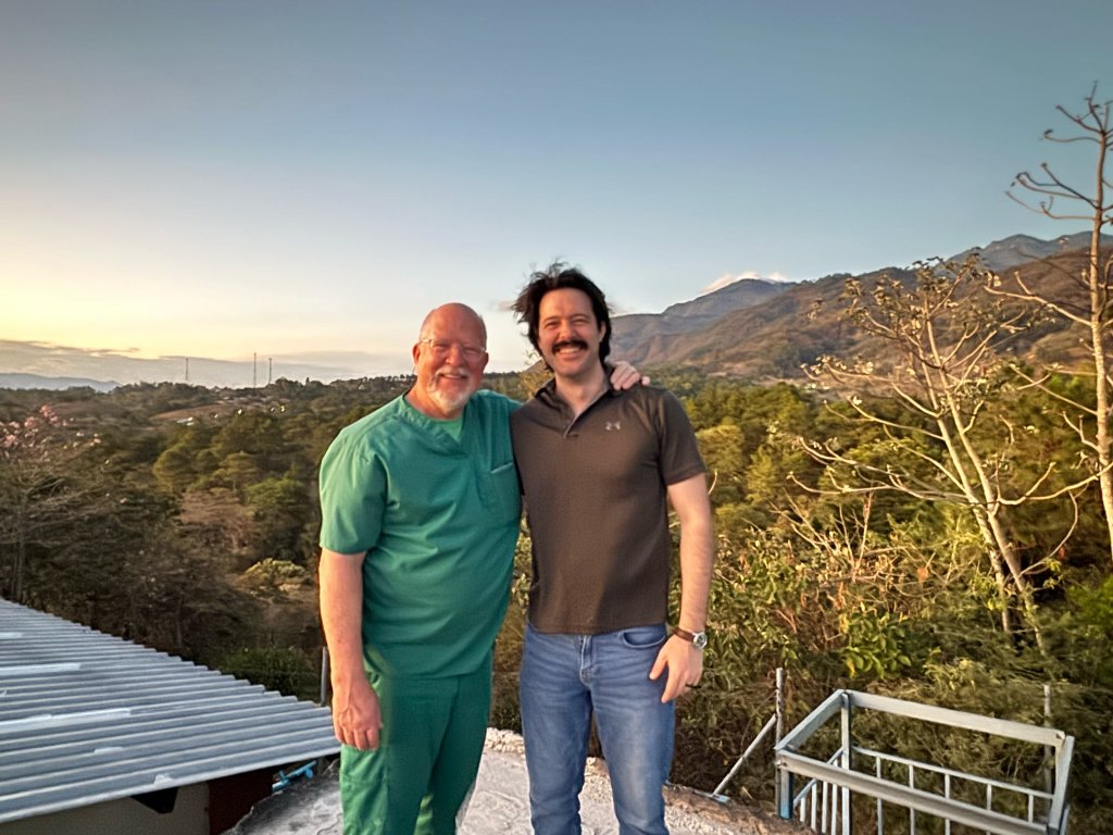 Team members with mountain backdrop