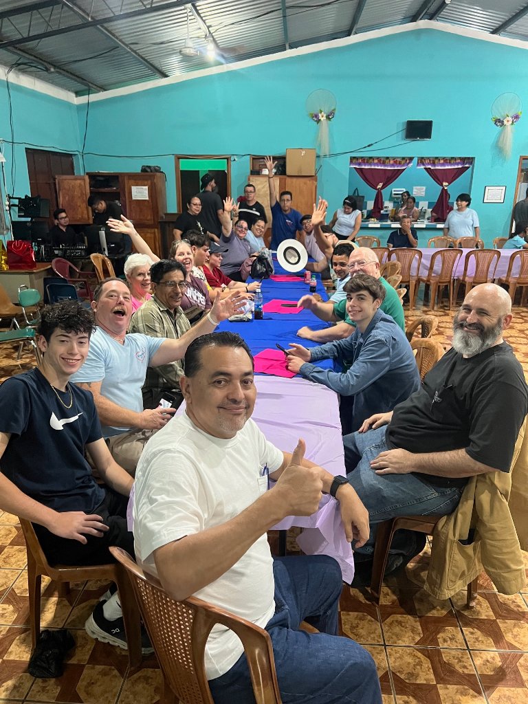 Full team gathering at dinner table
