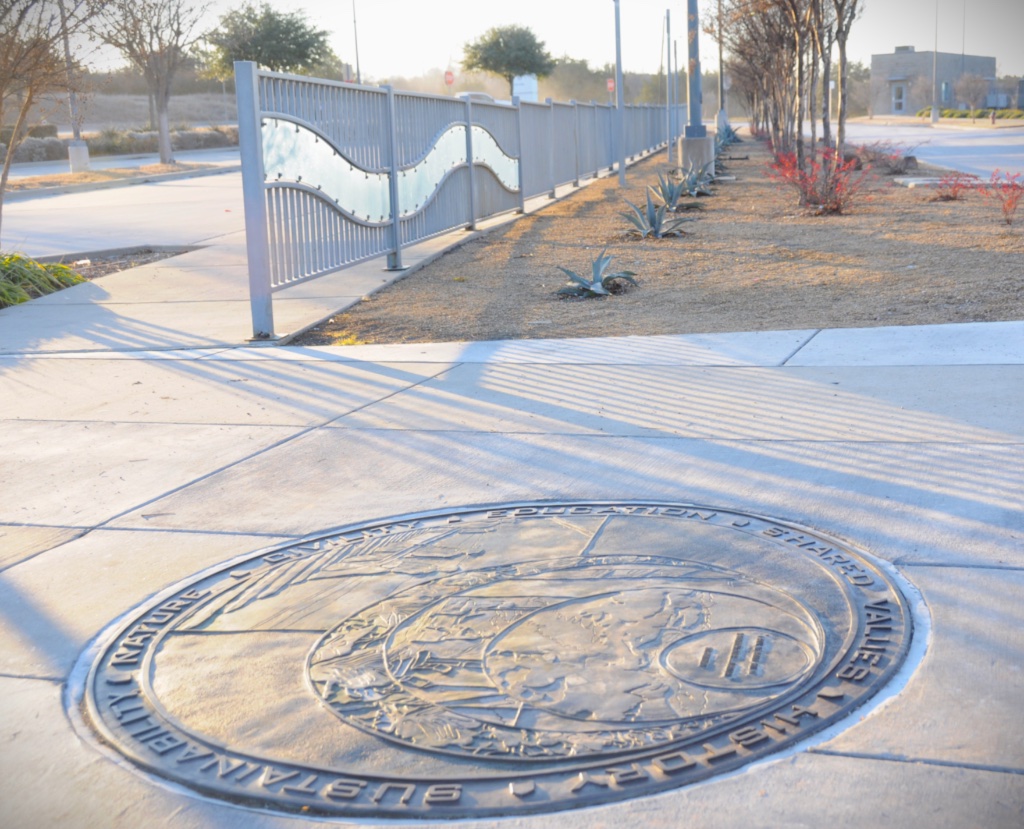 Bronze plate and guardrail design installed