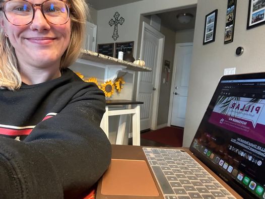 Attendee at home with laptop