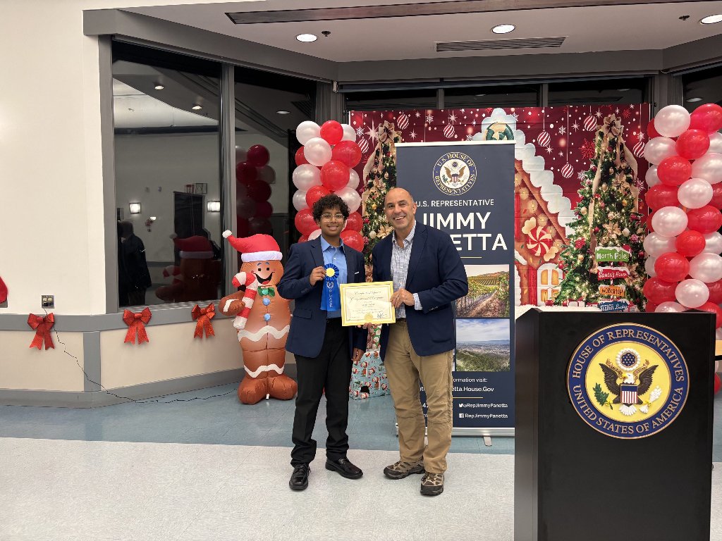 Saumit Pathak receiving Congressional App Challenge award from Rep. Jimmy Panetta