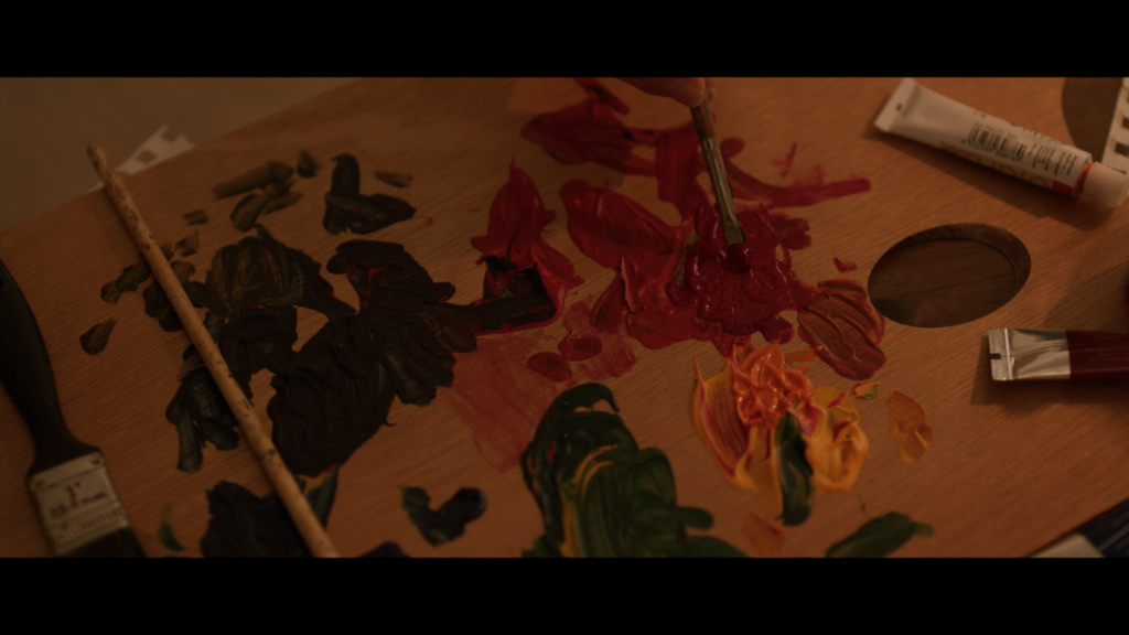 Palette of Dreams still of paint spread across a palette