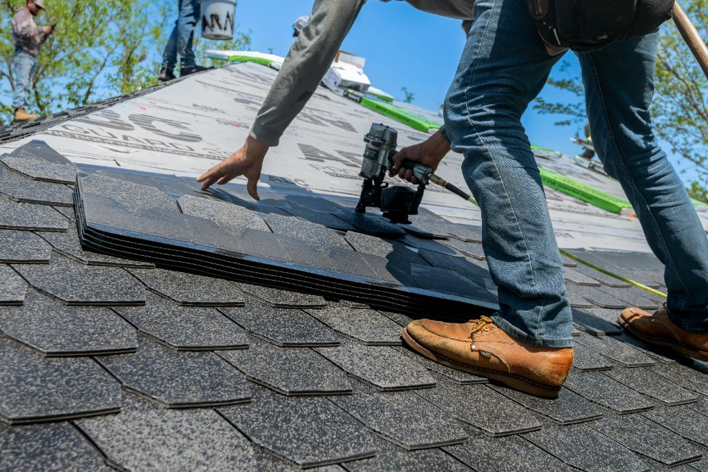 Grablis Roofing crew installing shingles
