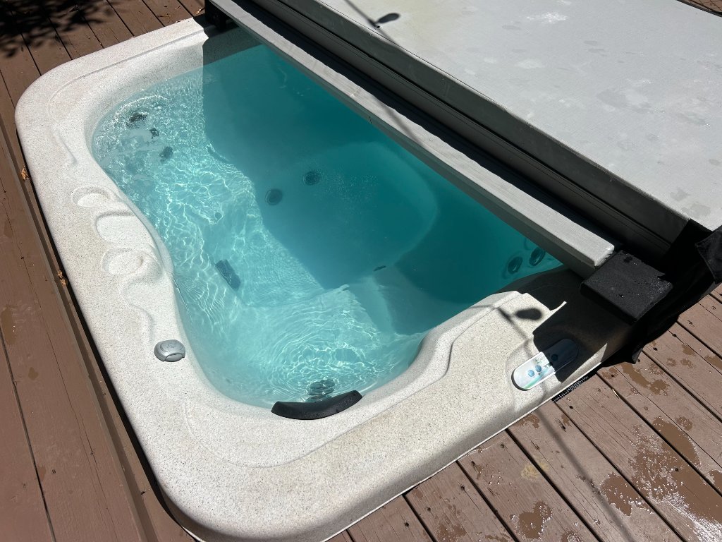 Hot tub on wooden deck during monthly spa service