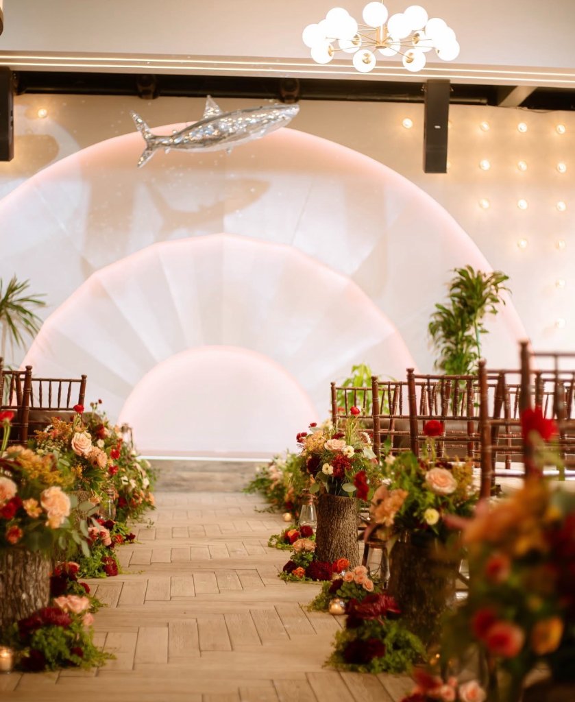 Elegant wedding ceremony with floral aisle decor