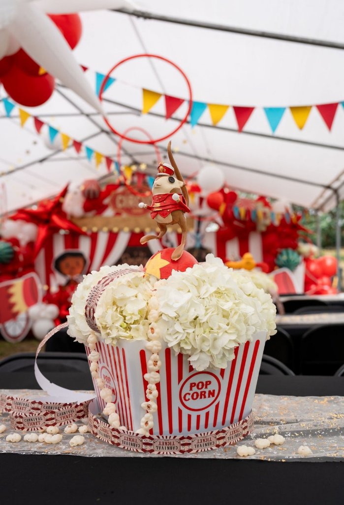 Circus tent event setup with balloon garland and star decorations