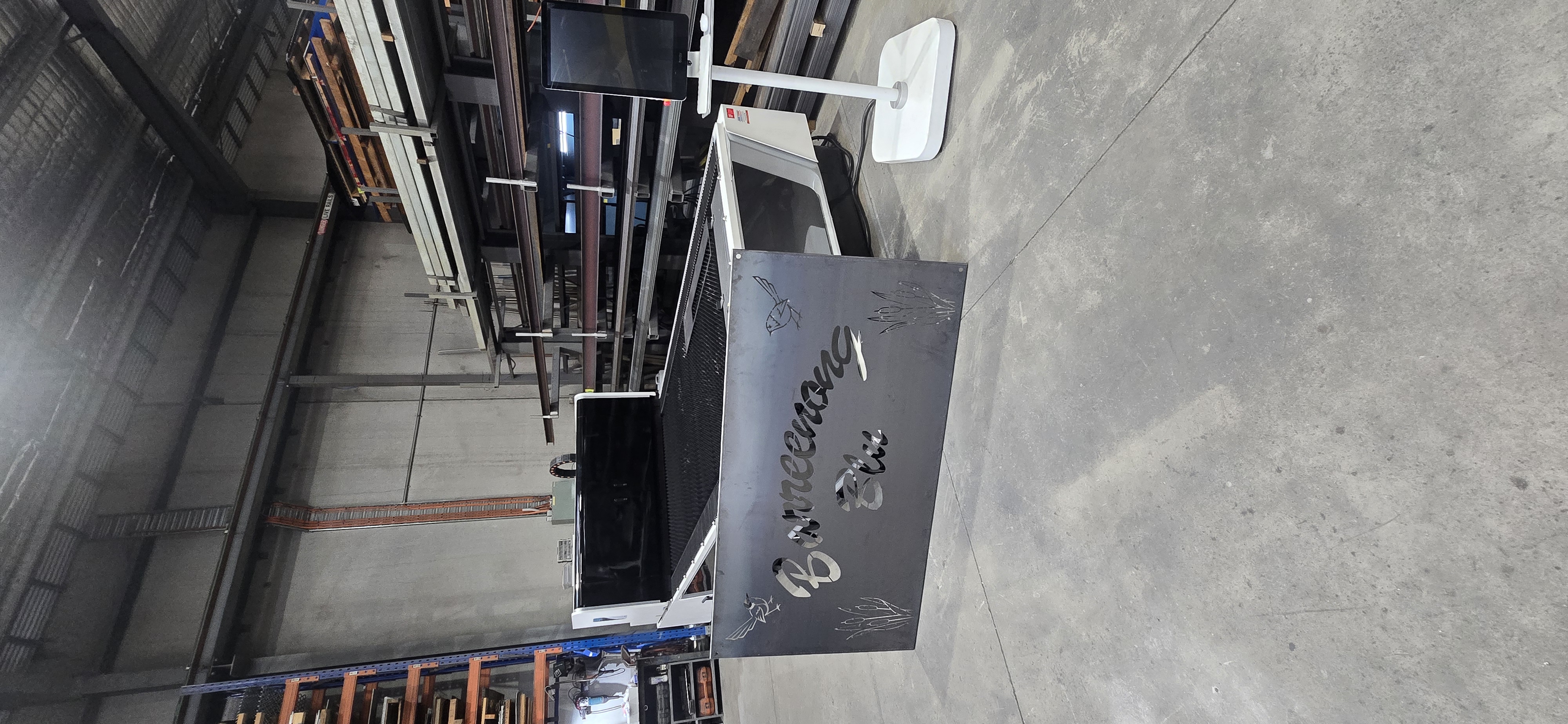 Laser cut metal sign with cursive "Boorooing Glen" text, bird and reed silhouettes, fresh off the BODOR fiber laser