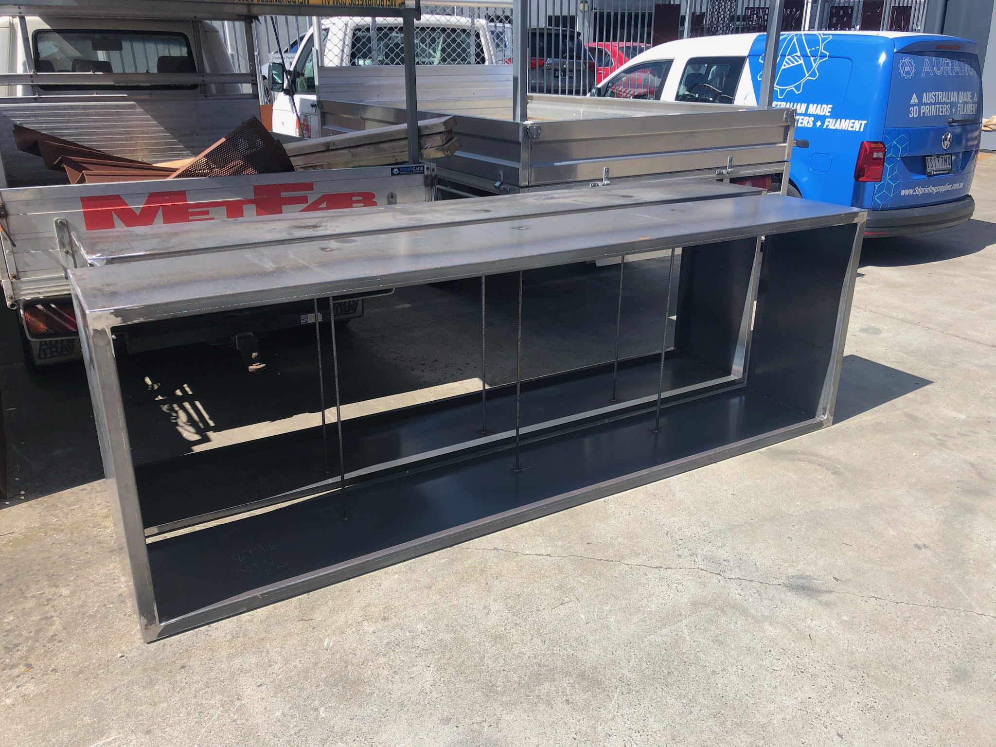Raw steel corten planter box frame on the MetFab workshop yard