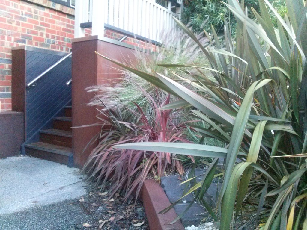Corten steel cladding with landscaping