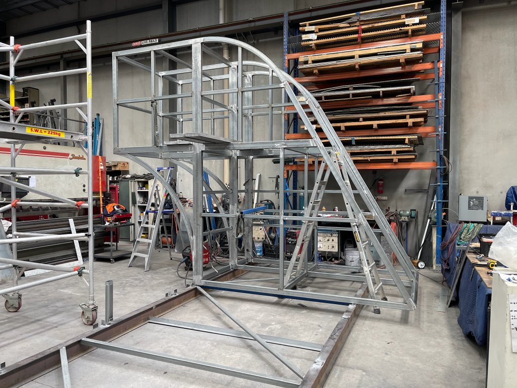 Large steel ramp framework under construction in workshop