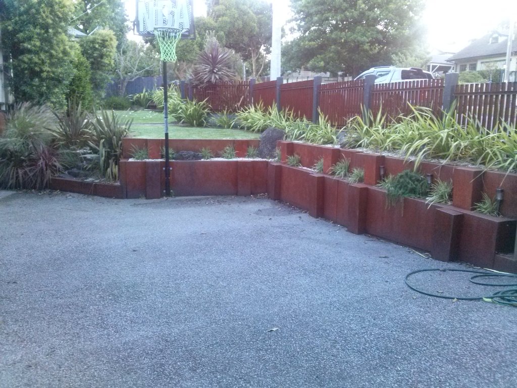 Corten steel cladding tiered garden beds