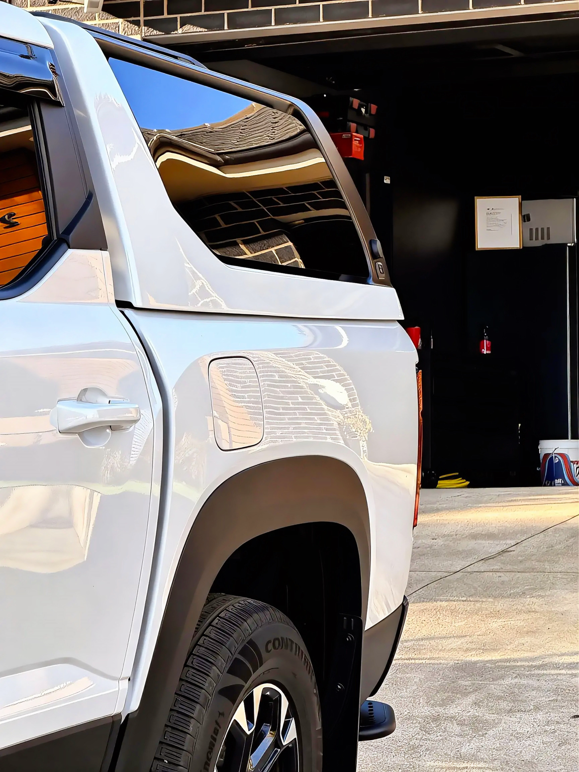 Reflections reading cleanly through the rear quarter after the final stage.