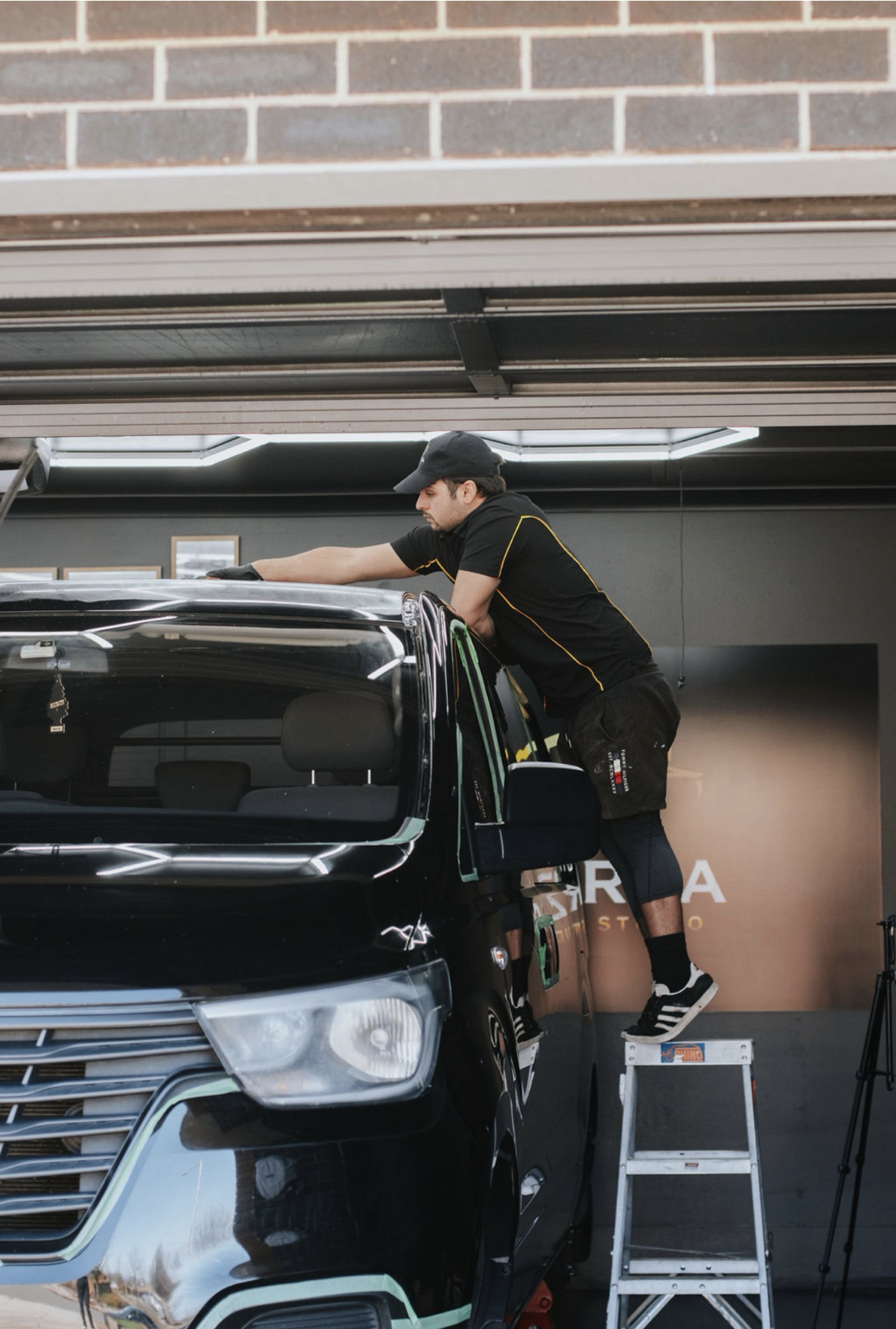 Ongoing preservation work on a vehicle inside the Forza studio