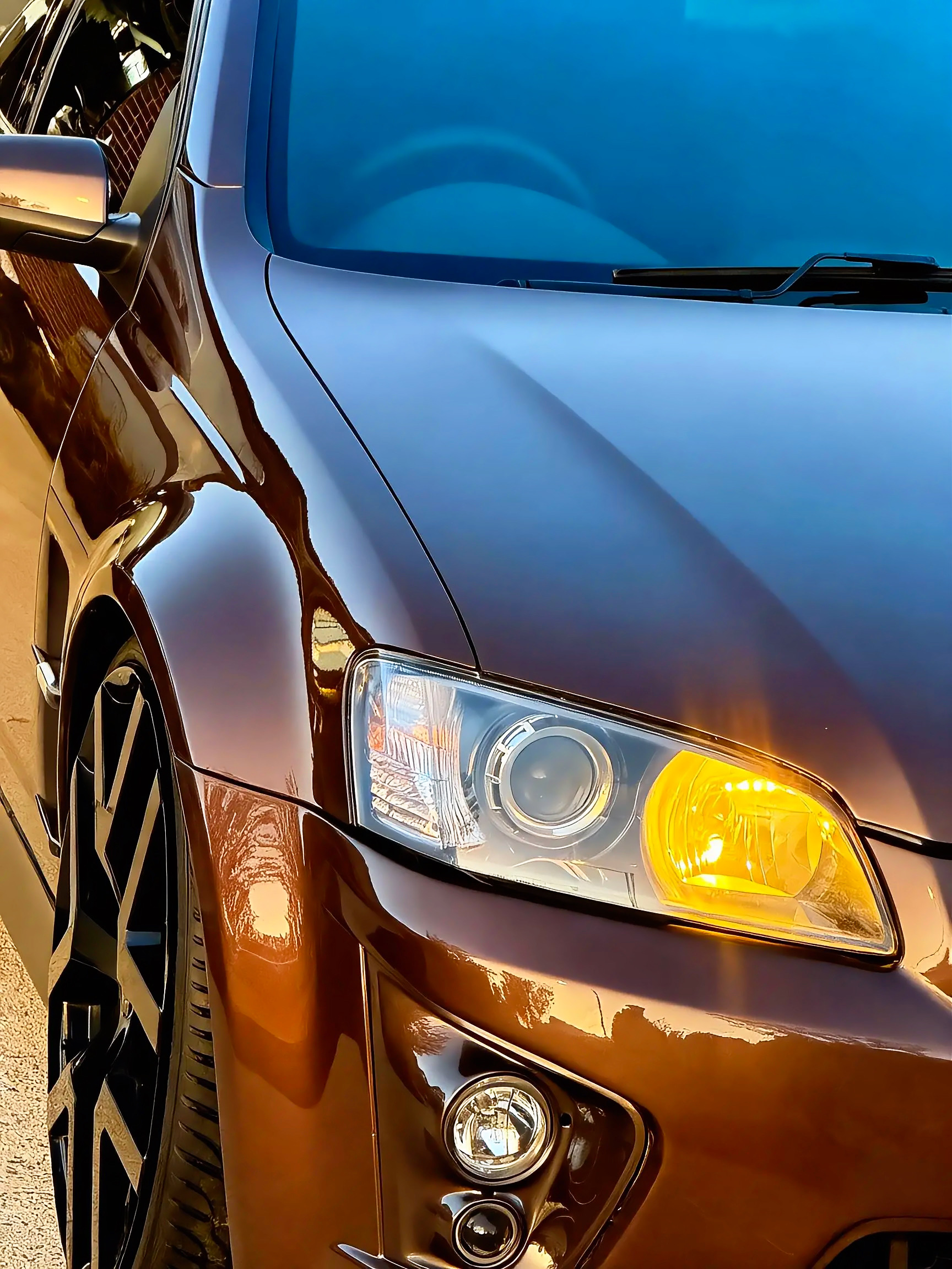 Close-up of a protected front fender and headlight finish