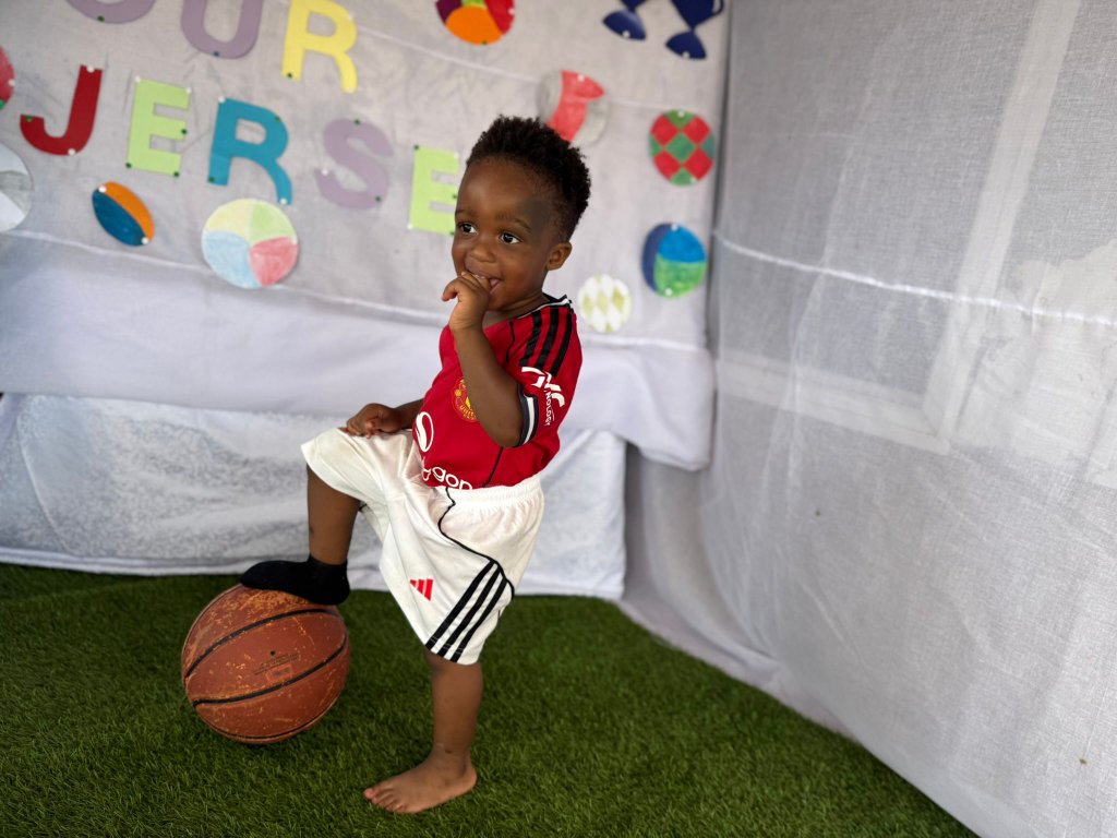 Child posing with basketball