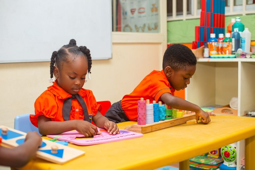 Teacher guiding a child through Montessori activities