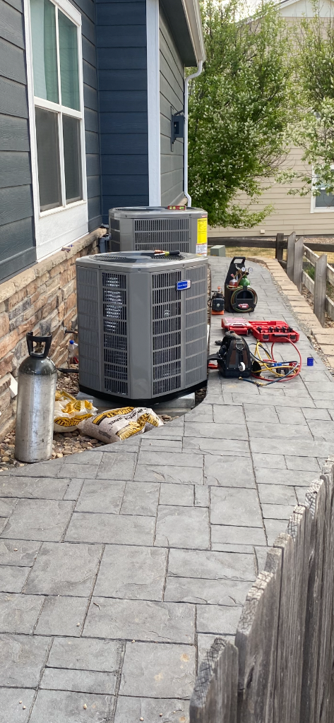 New dual AC condenser installation in progress — Highlands Ranch Heating & Air