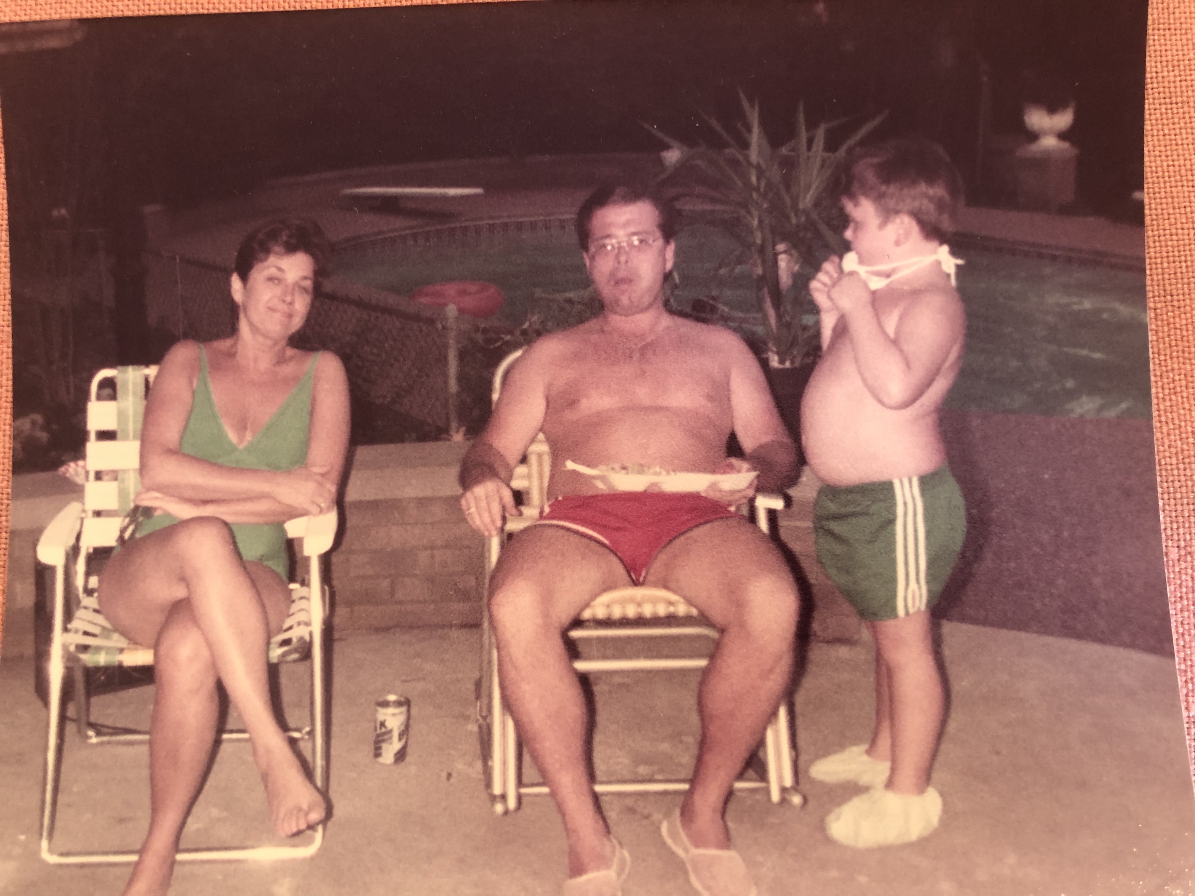 The author as a boy with his parents beside the family pool, 1970s snapshot