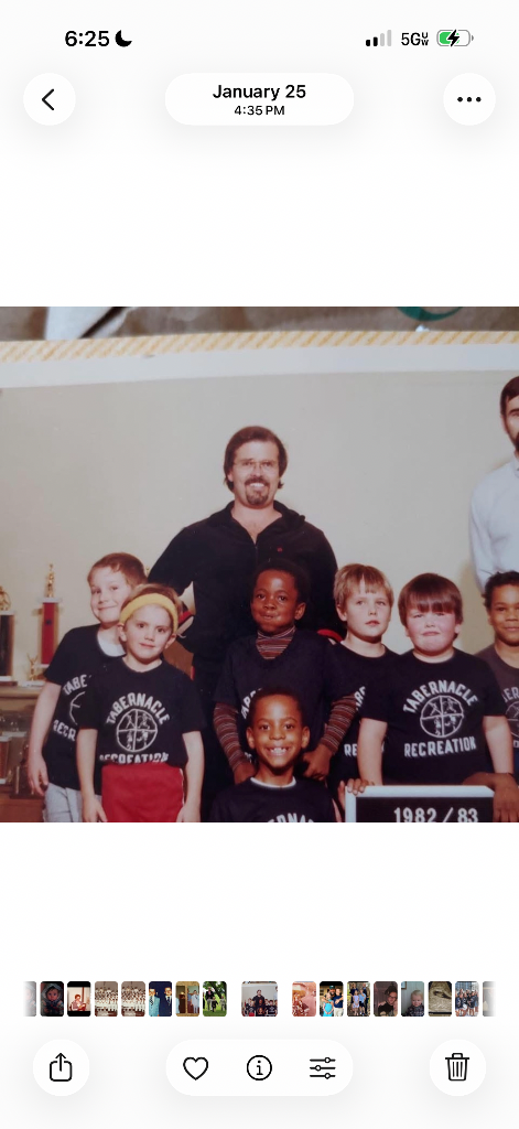 A youth basketball team in Tabernacle Recreation shirts, 1982/83, with the coach standing in back