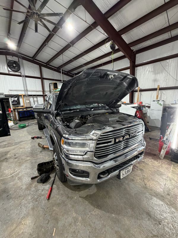 Silver Ram 2500 Cummins in the shop bay