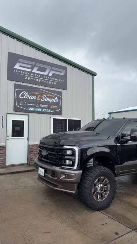 Ford F-250 outside the Express Diesel Performance sign