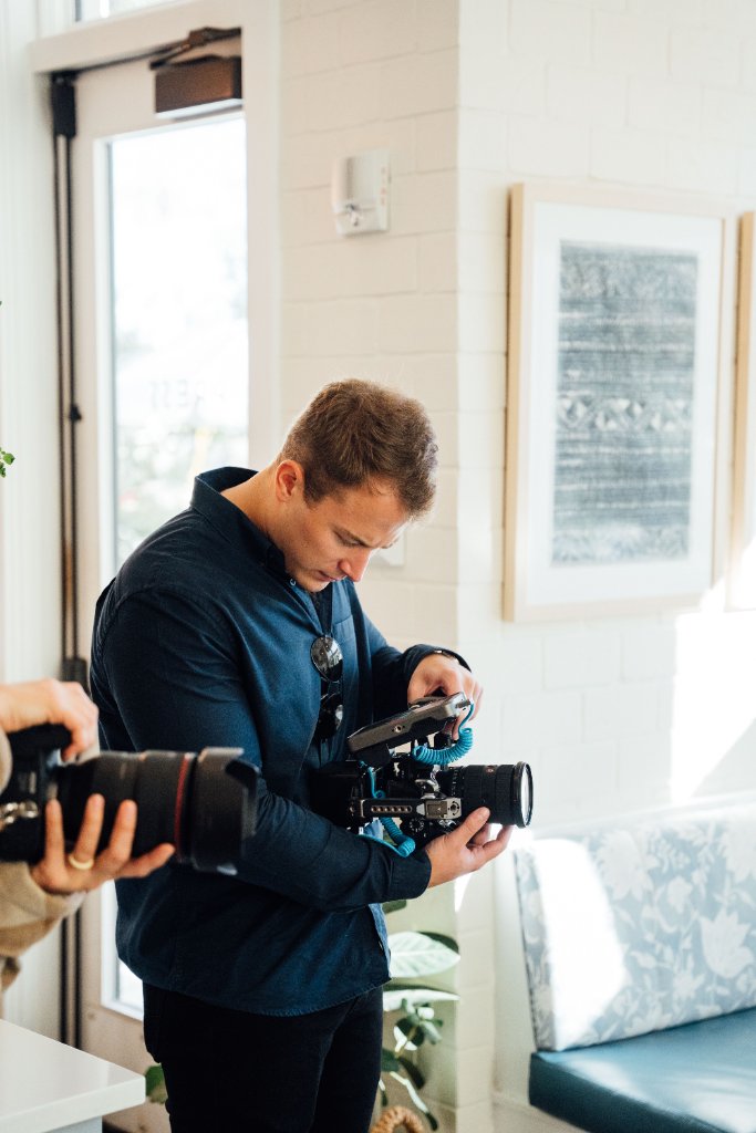 McCoy Visuals filmmaker operating cinema camera on location for a Gulf Coast brand