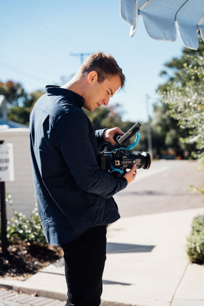 McCoy Visuals crew reviewing playback footage during a professional brand video session
