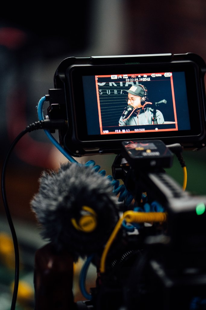 McCoy Visuals crew reviewing playback footage during a professional brand video session
