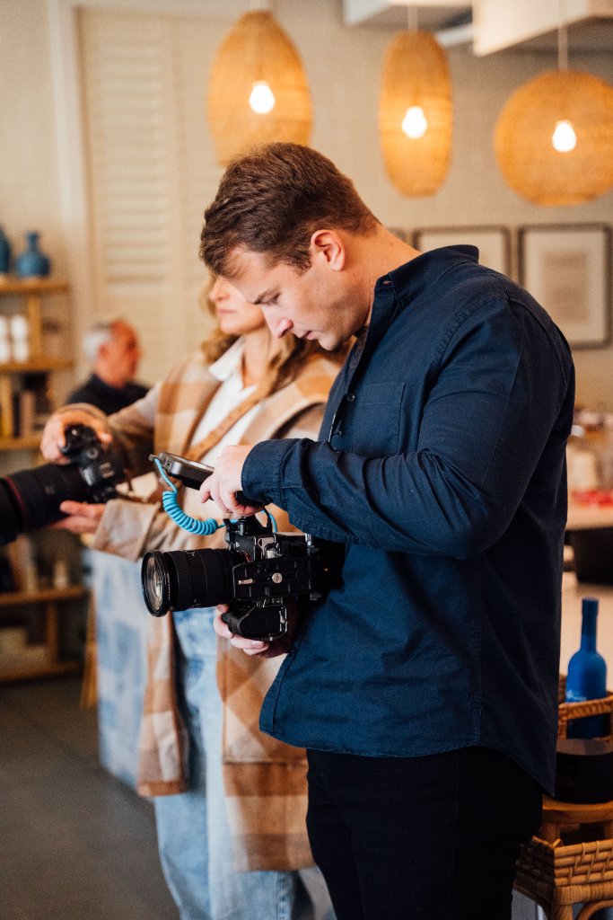 Professional video production crew from McCoy Visuals preparing equipment for a commercial shoot
