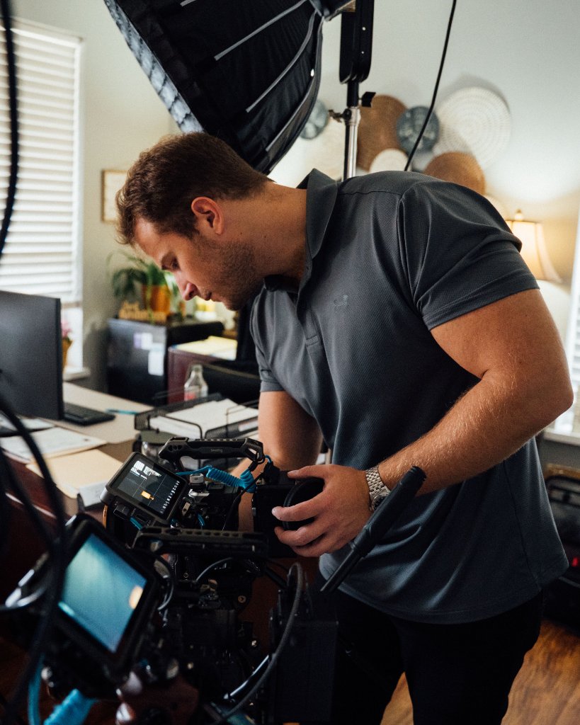McCoy Visuals crew setting up professional lighting rig for a commercial brand shoot
