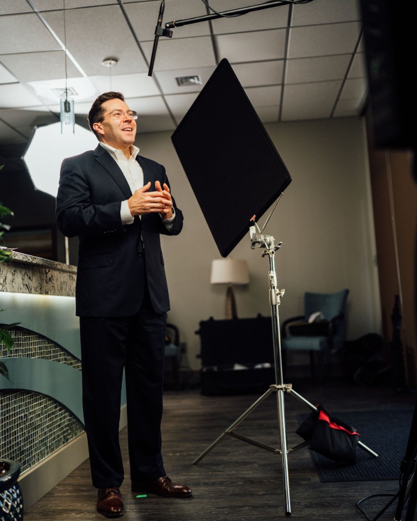 McCoy Visuals filmmaker operating cinema camera on location for a Gulf Coast brand