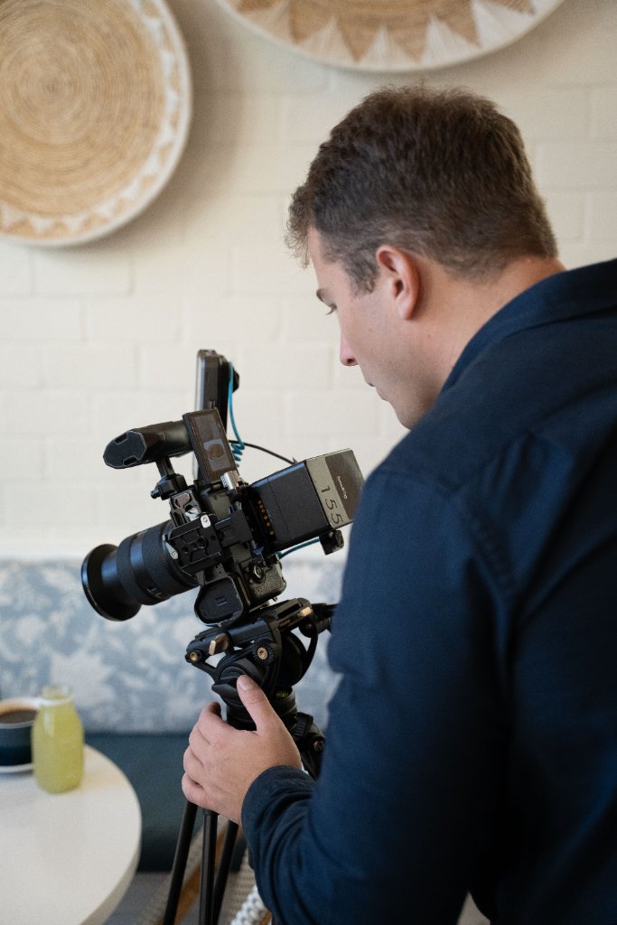 McCoy Visuals crew reviewing playback footage during a professional brand video session