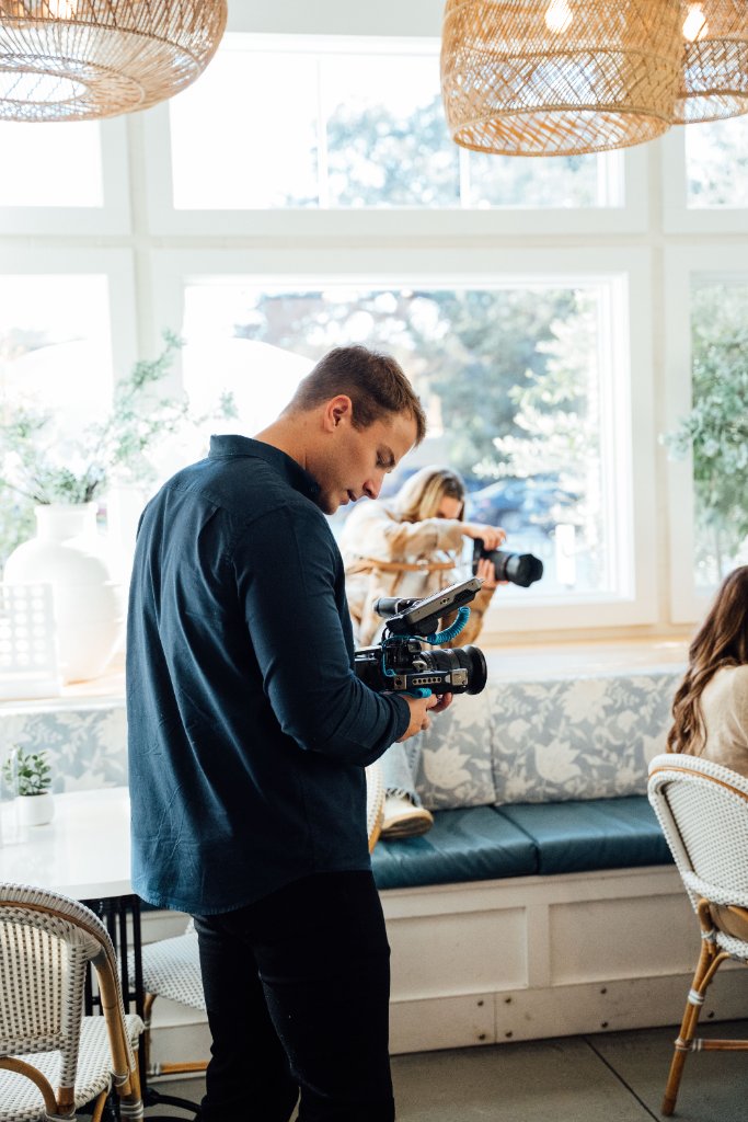 McCoy Visuals crew reviewing playback footage during a professional brand video session