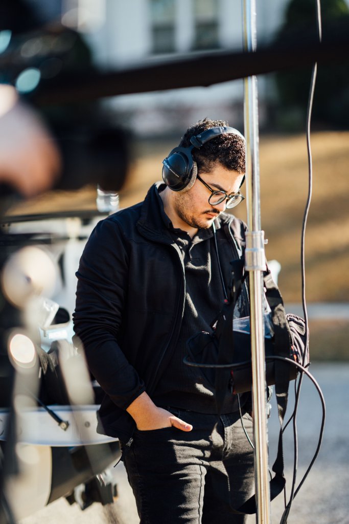 McCoy Visuals filmmaker operating cinema camera on location for a Gulf Coast brand