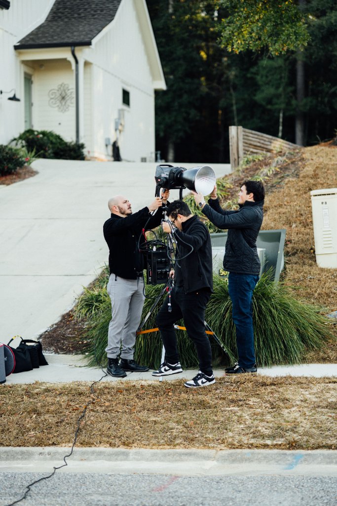 McCoy Visuals crew reviewing playback footage during a professional brand video session