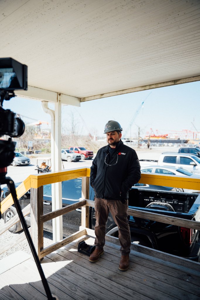 McCoy Visuals director of photography reviewing shot composition on commercial film set