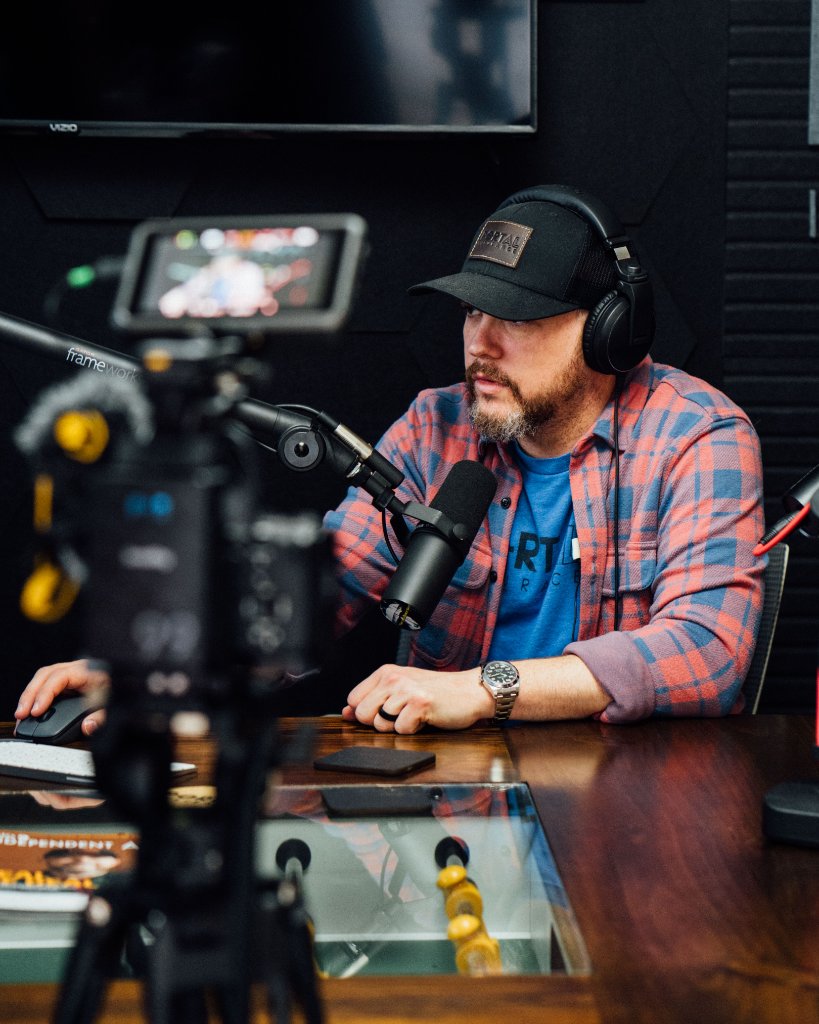 McCoy Visuals camera operator framing a cinematic shot during a commercial production