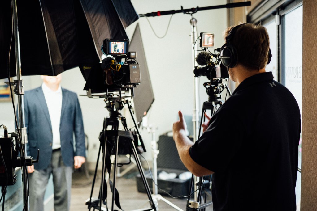 McCoy Visuals camera operator framing a cinematic shot during a commercial production