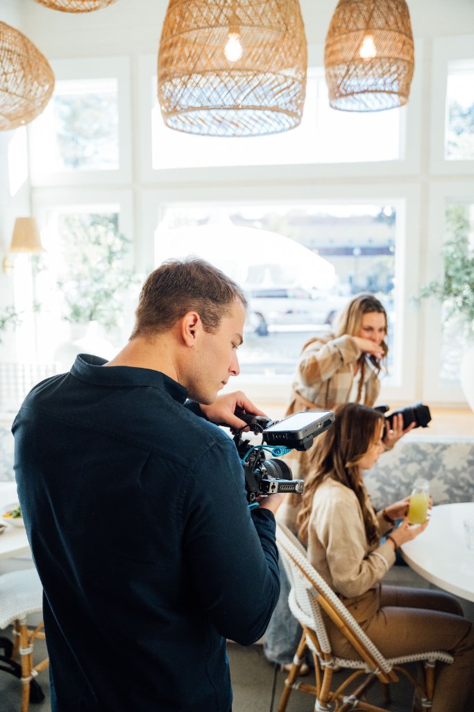 McCoy Visuals camera operator framing a cinematic shot during a commercial production