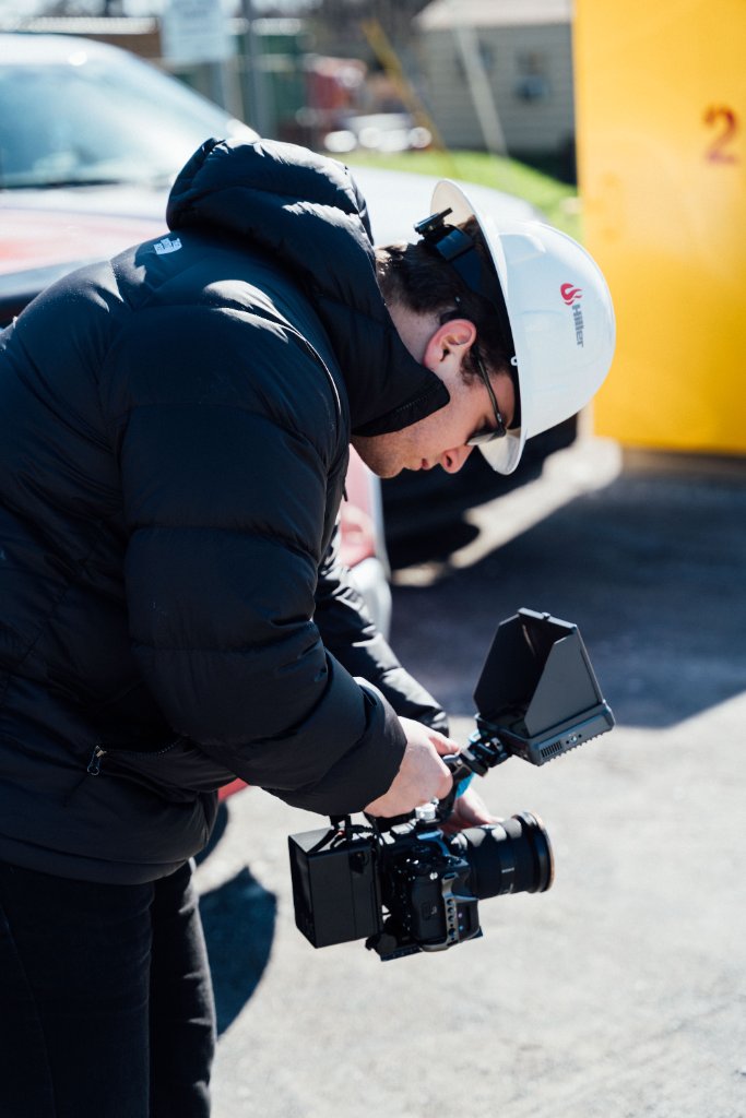 McCoy Visuals filmmaker operating cinema camera on location for a Gulf Coast brand