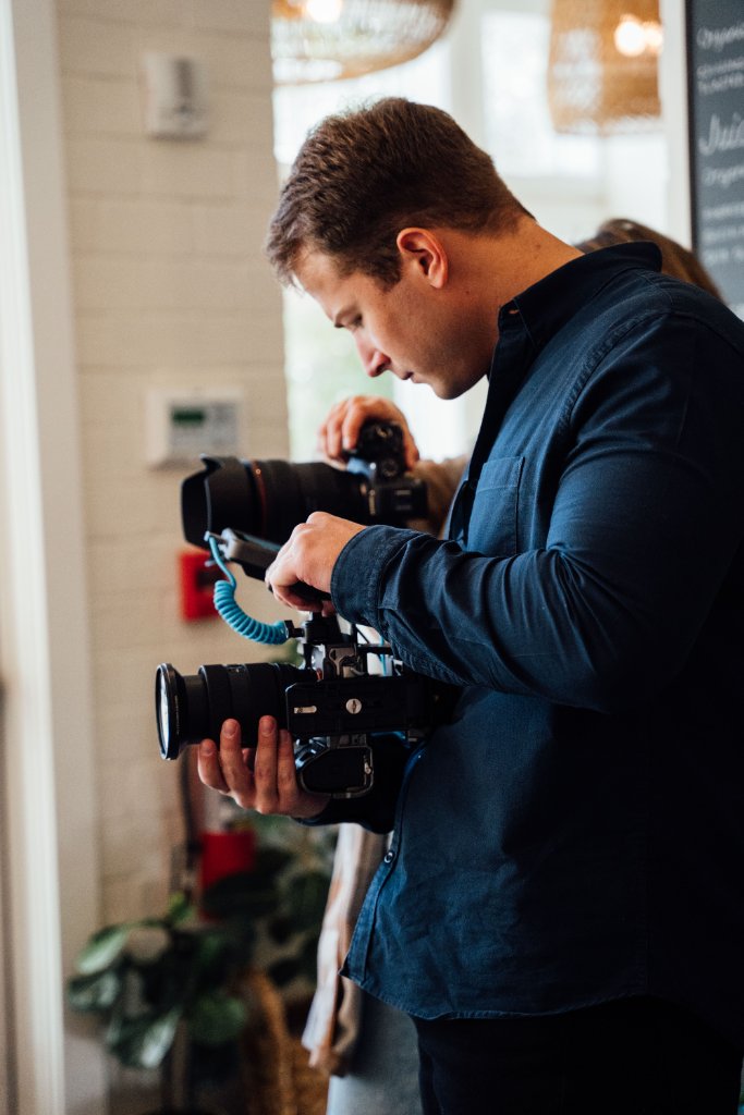 McCoy Visuals crew reviewing playback footage during a professional brand video session