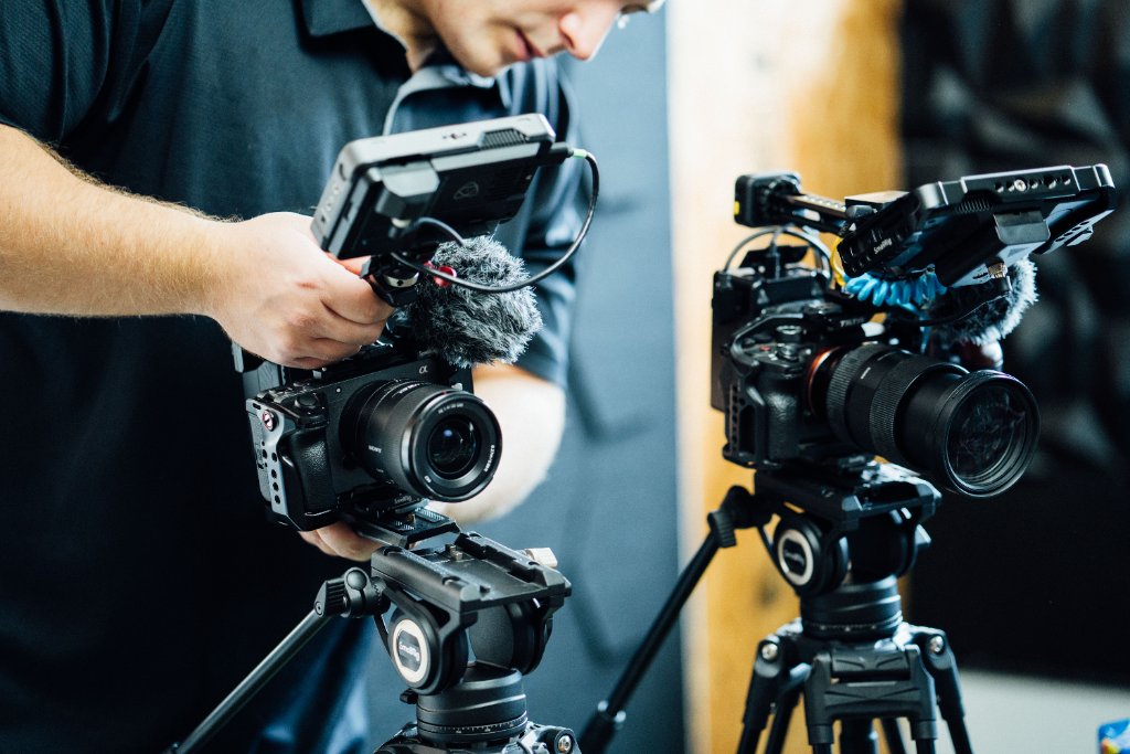 McCoy Visuals filmmaker operating cinema camera on location for a Gulf Coast brand