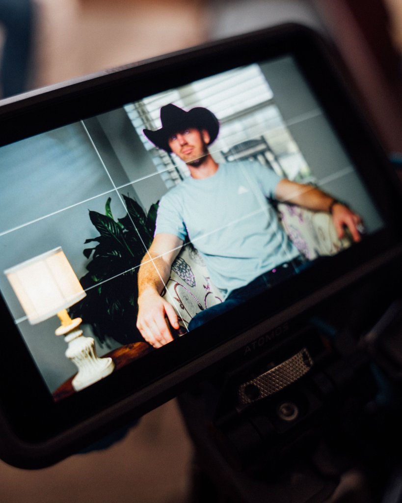 McCoy Visuals filmmaker operating cinema camera on location for a Gulf Coast brand