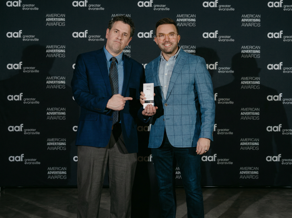 Daniel Benedict and Jason Tanner accept one of the Addy Awards